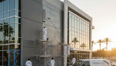 Commercial building painters in Las Vegas NV applying durable exterior paint for local businesses