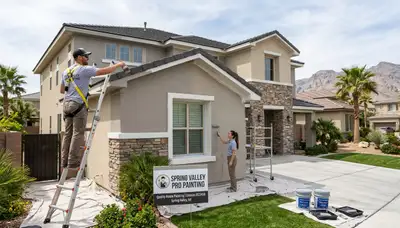 Professional house painters working on exterior home in Las Vegas NV